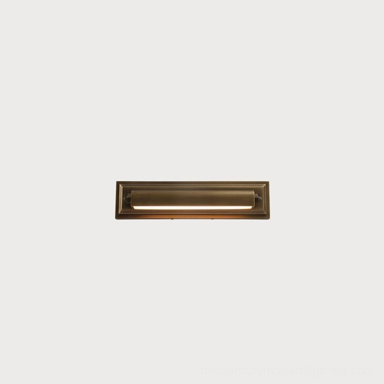 Davenport tiered wall sconce compact size variant, antique brass finish with architectural stepped design and warm LED light