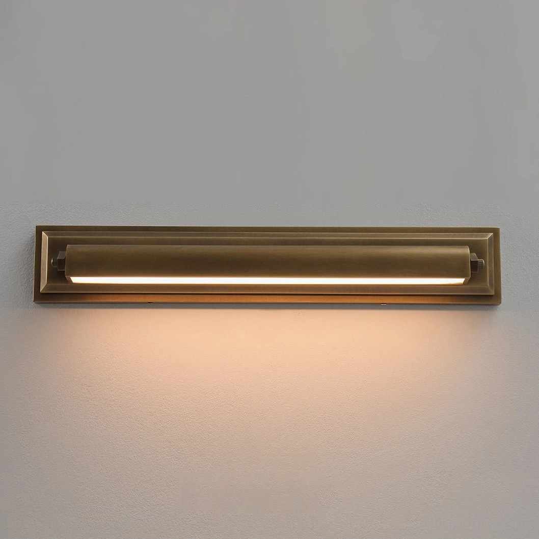 Low angle view of fully illuminated Davenport sconce, warm LED glow with aged bronze metal frame and layered construction