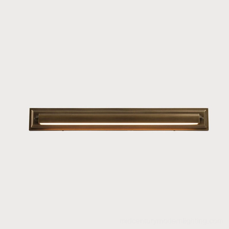 Davenport tiered wall sconce large size variant, antique brass stepped backplate with full warm LED illumination and architectural depth