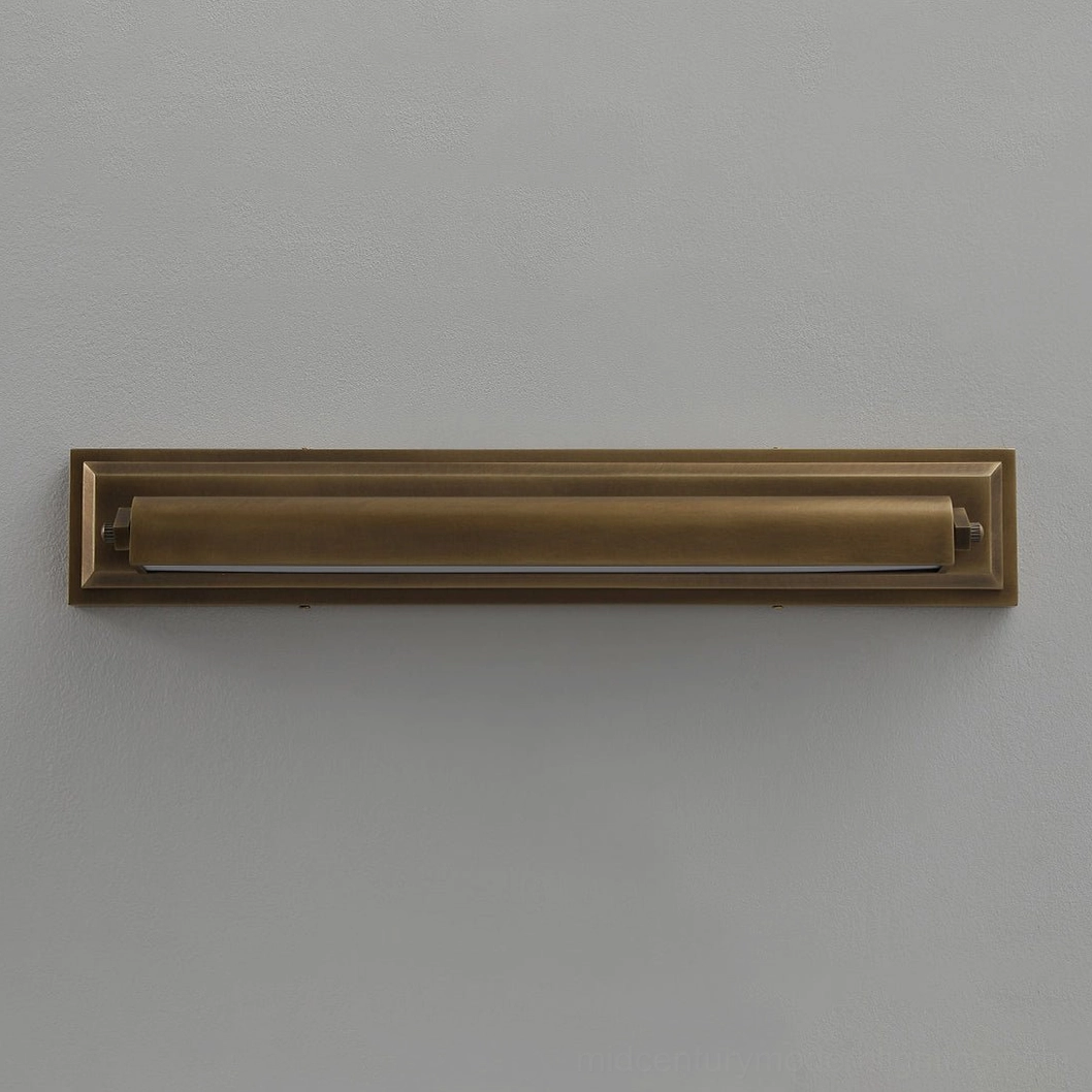 Front flat view of unlit Davenport tiered sconce, solid antique brass frame showing geometric stepped architectural lines