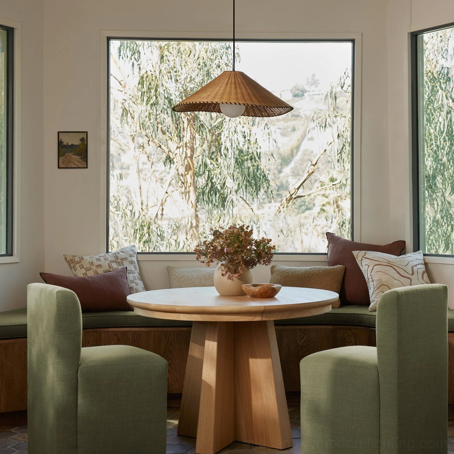 Davida rattan pendant fixture showing metal canopy, cord suspension, and opal glass globe centered below woven shade
