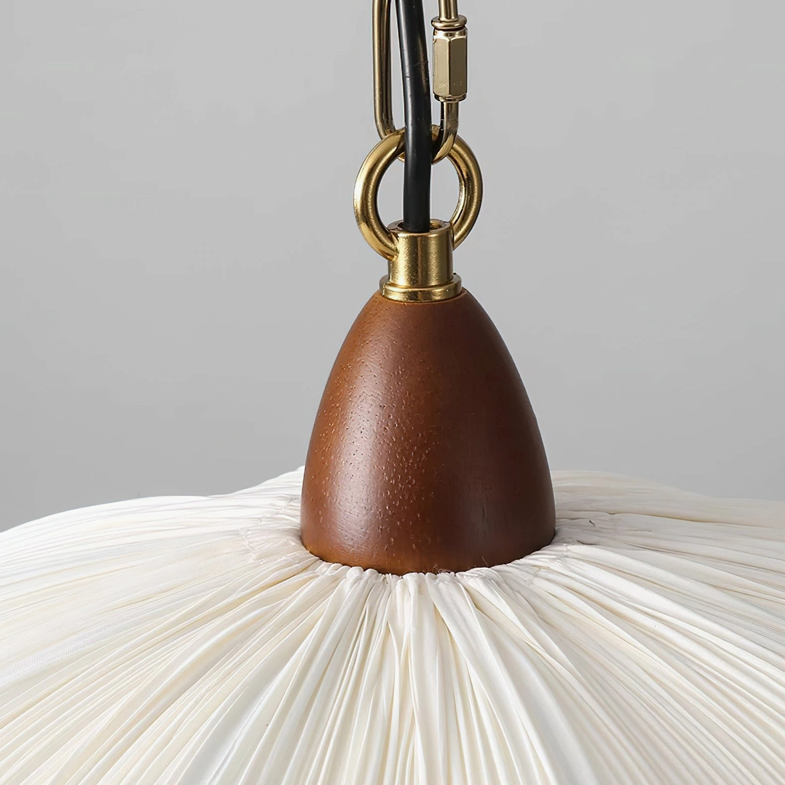 Detailed close-up of Dawson pendant light wood accents and scalloped fabric shade construction