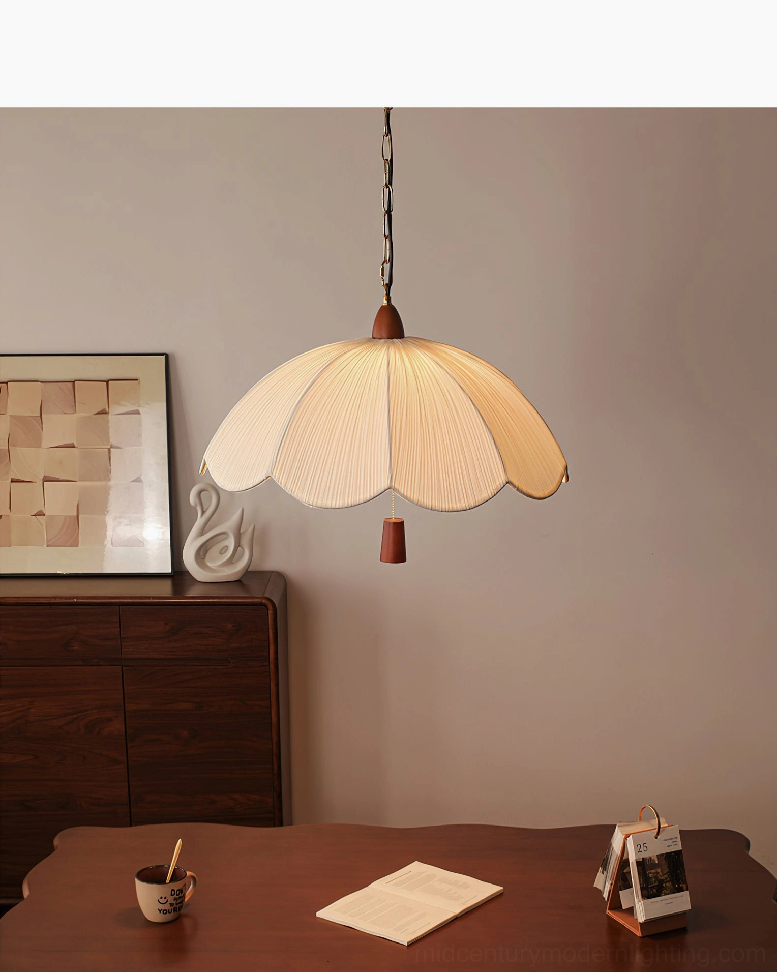Scalloped fabric pendant light with wood accents over farmhouse dining table, retro vintage style