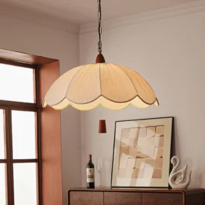 Dawson pendant light hanging in vintage dining room above wooden sideboard, warm mid-century modern lighting