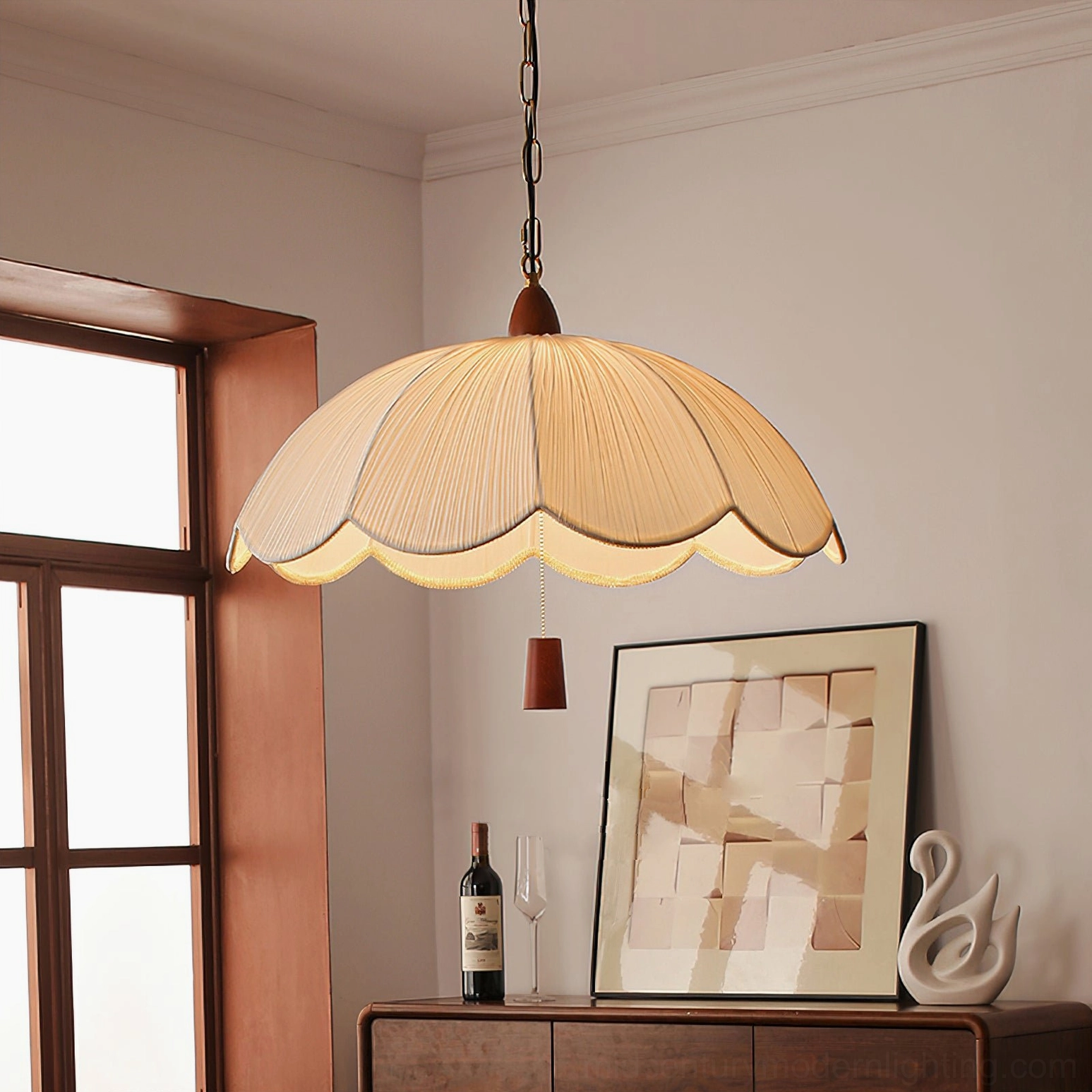 Dawson pendant light hanging in vintage dining room above wooden sideboard, warm mid-century modern lighting