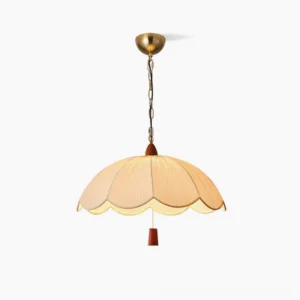Dawson mid-century pendant light with scalloped fabric shade and brass ceiling cap, studio front view
