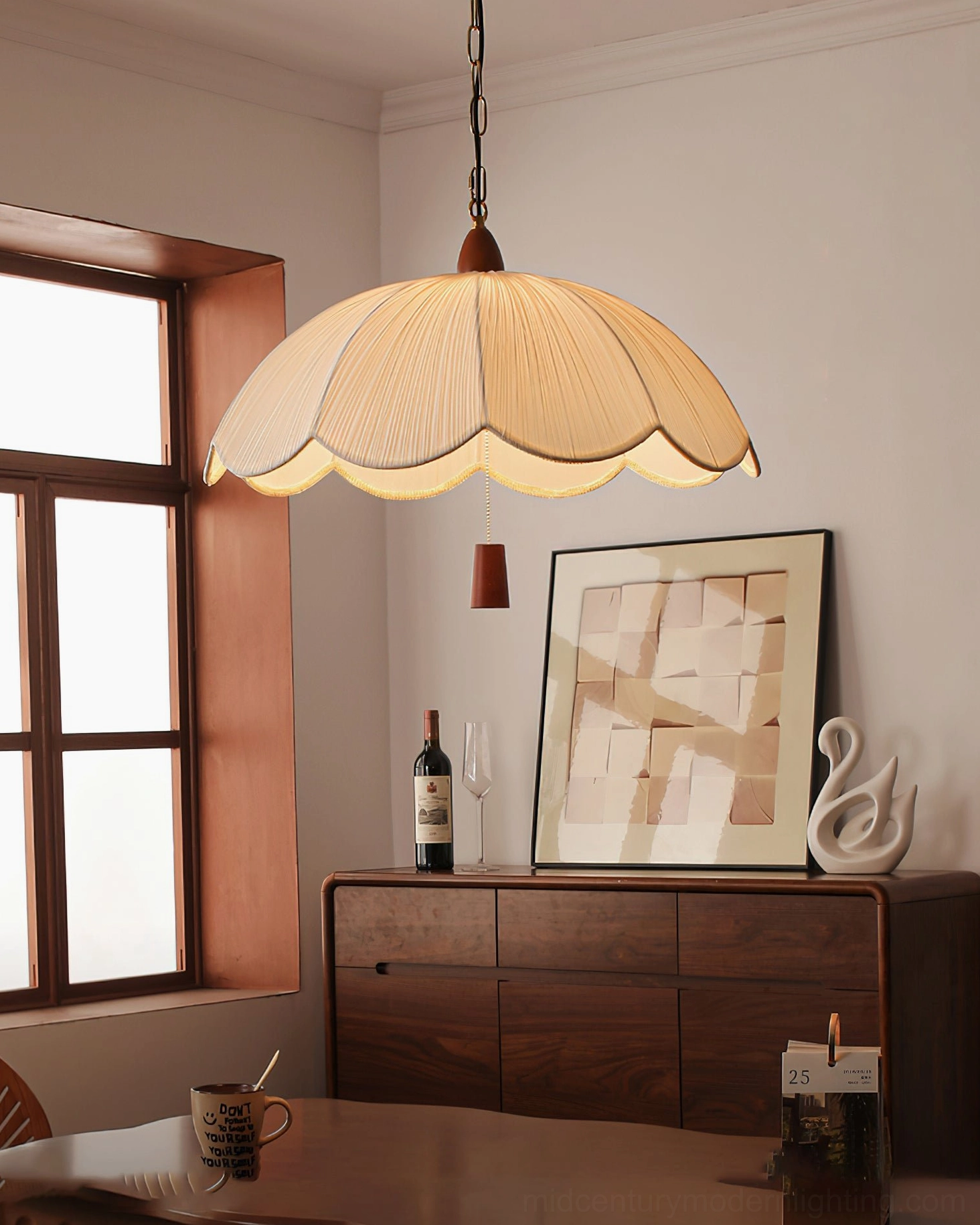 Walnut and gold pendant light casting soft warm glow in vintage home interior