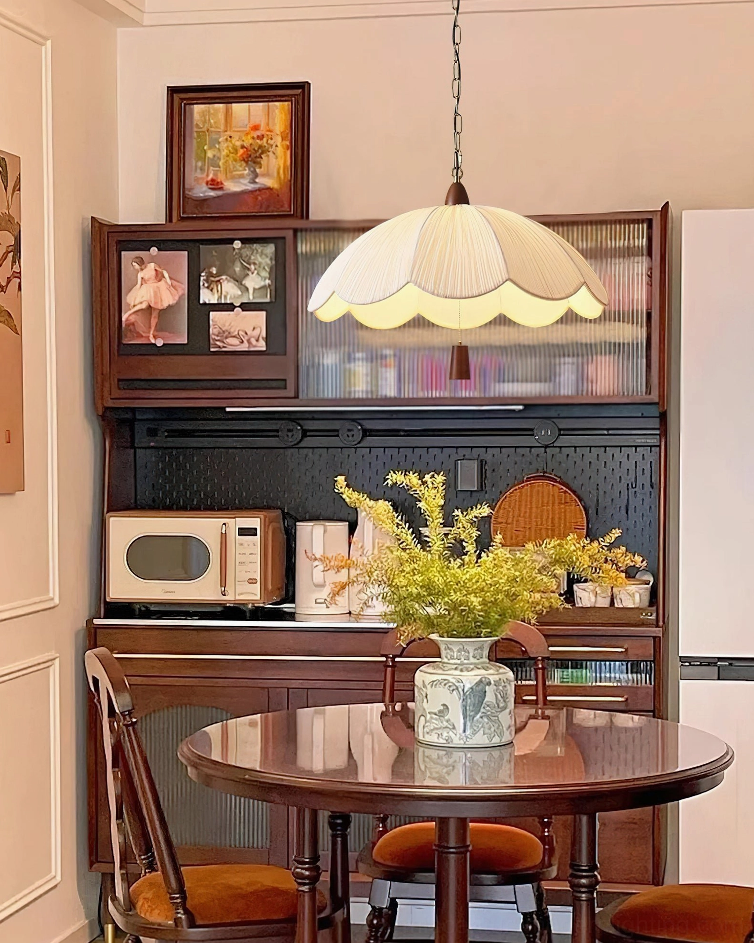 Beige scalloped pendant light with soft warm illumination in contemporary dining space