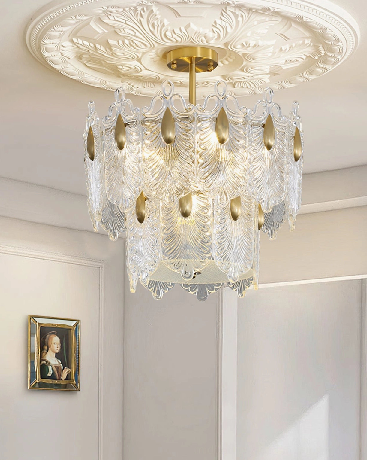 Decazes ceiling chandelier installed with ornate ceiling medallion, French traditional entryway, clear glass pendants and brass accents