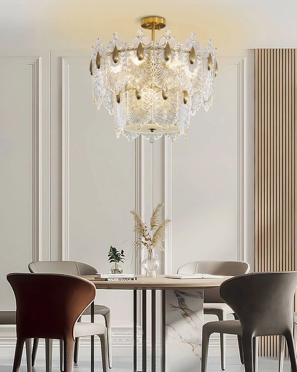 Dining room Decazes crystal chandelier, contemporary dining space with marble table, mixed upholstered chairs, decorative lighting