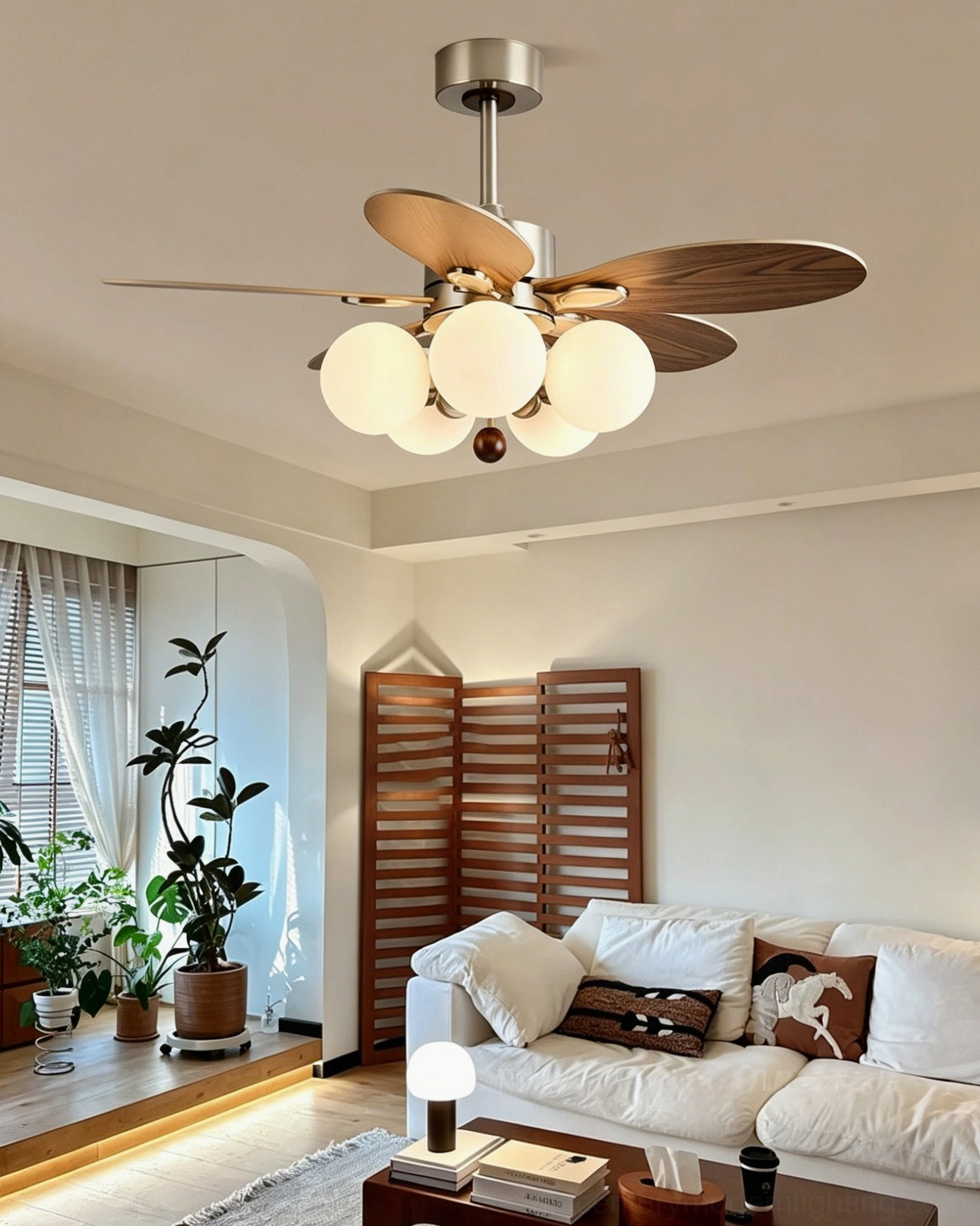 Contemporary ceiling fan light in cozy living room with sofa, demonstrating ambient lighting from frosted glass globes in relaxed rustic home setting