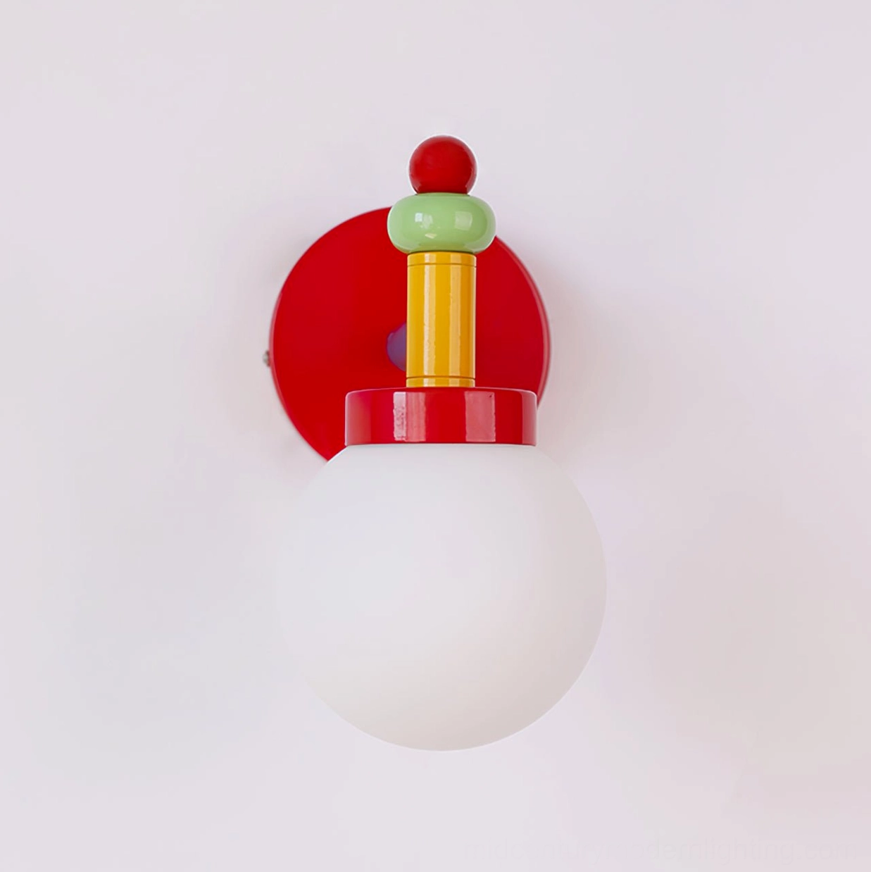 Unlit colorful wall sconce with stacked metal hardware details on plain white wall background