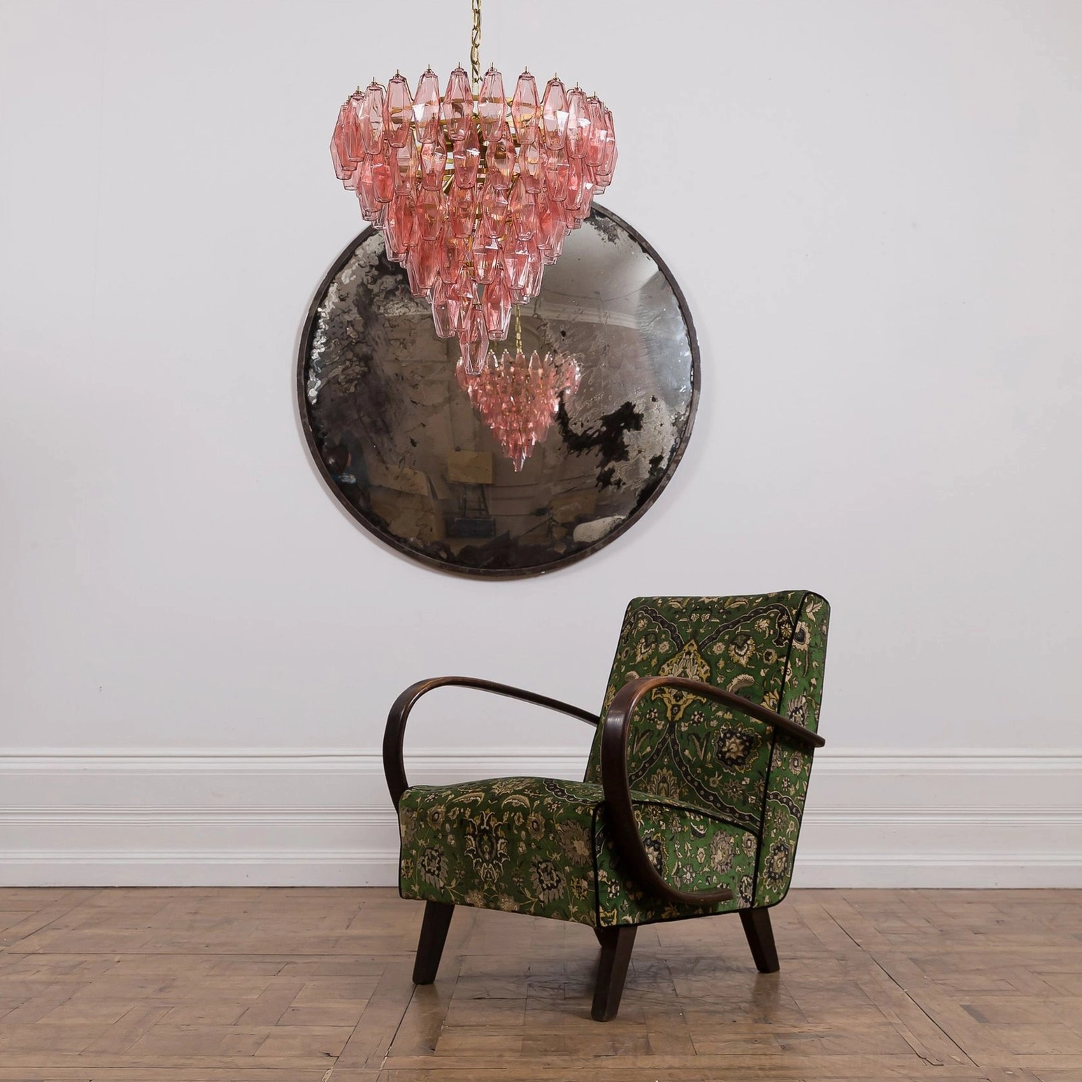 Deep pink tiered crystal chandelier geometric light fixture in vintage-inspired room setting