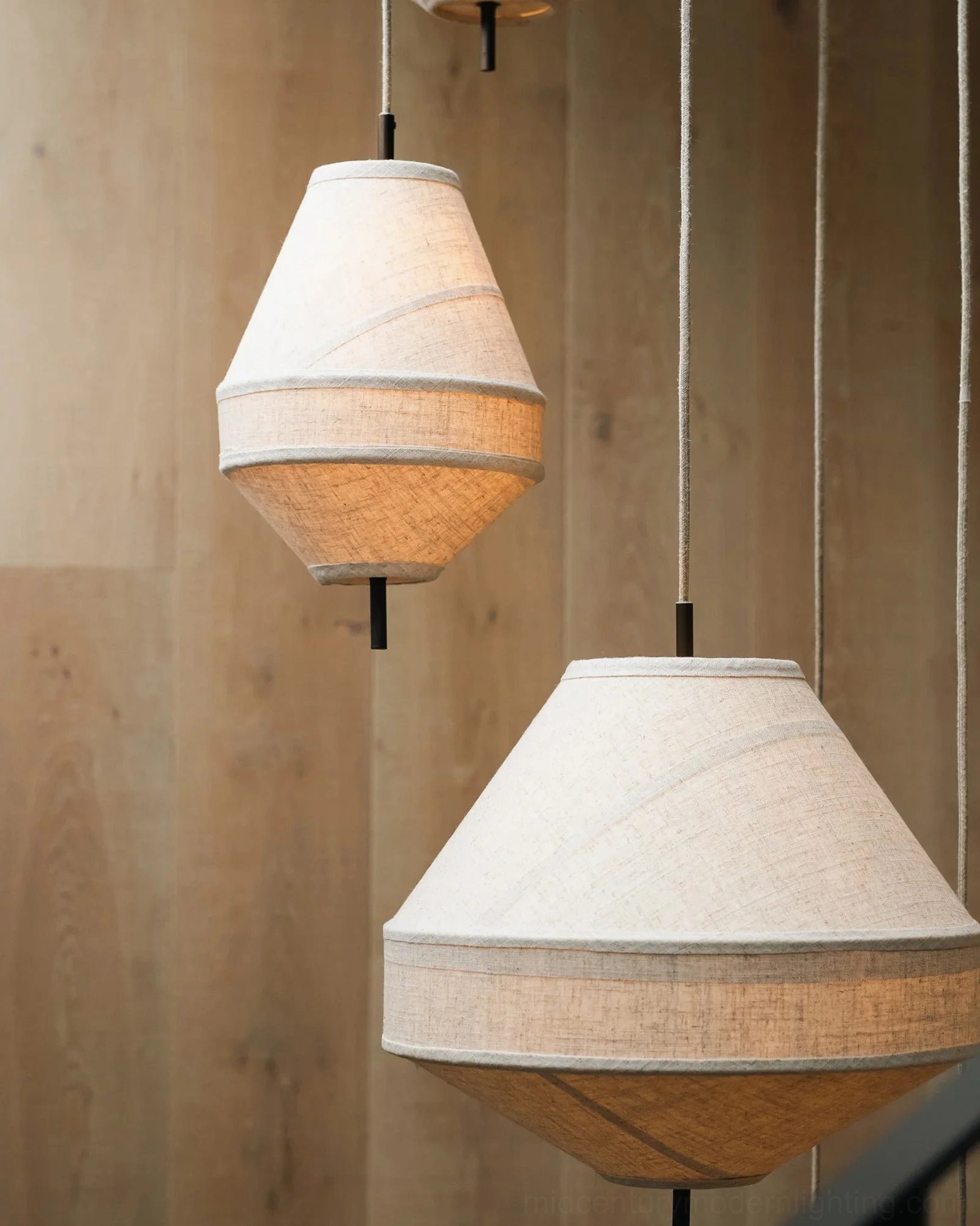 Delaney geometric pendant and tapered fabric shade design comparison, eye-level frontal view