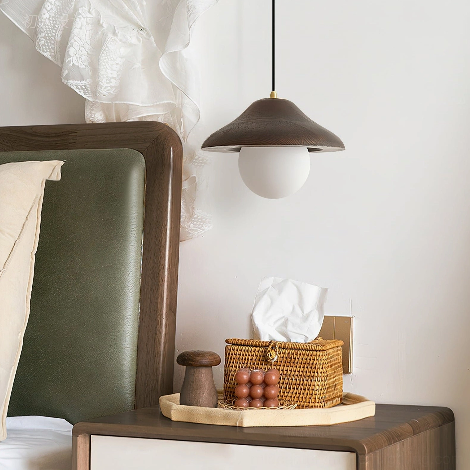 Delano pendant light hanging in bedroom bedside corner, showing warm glowing ambient light and vintage cottage aesthetic