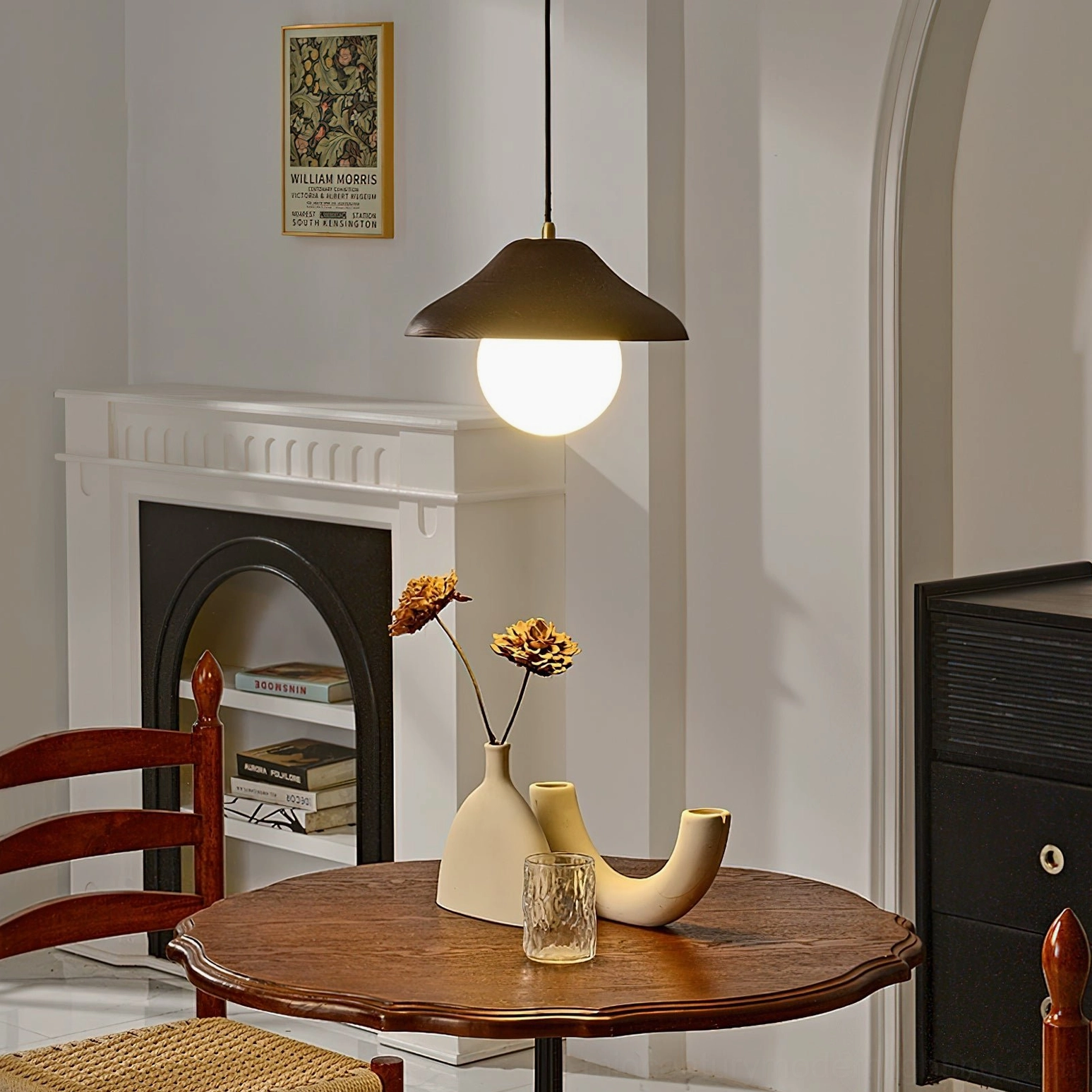 Delano mid-century modern pendant light in contemporary interior setting, highlighting walnut finish and frosted glass features