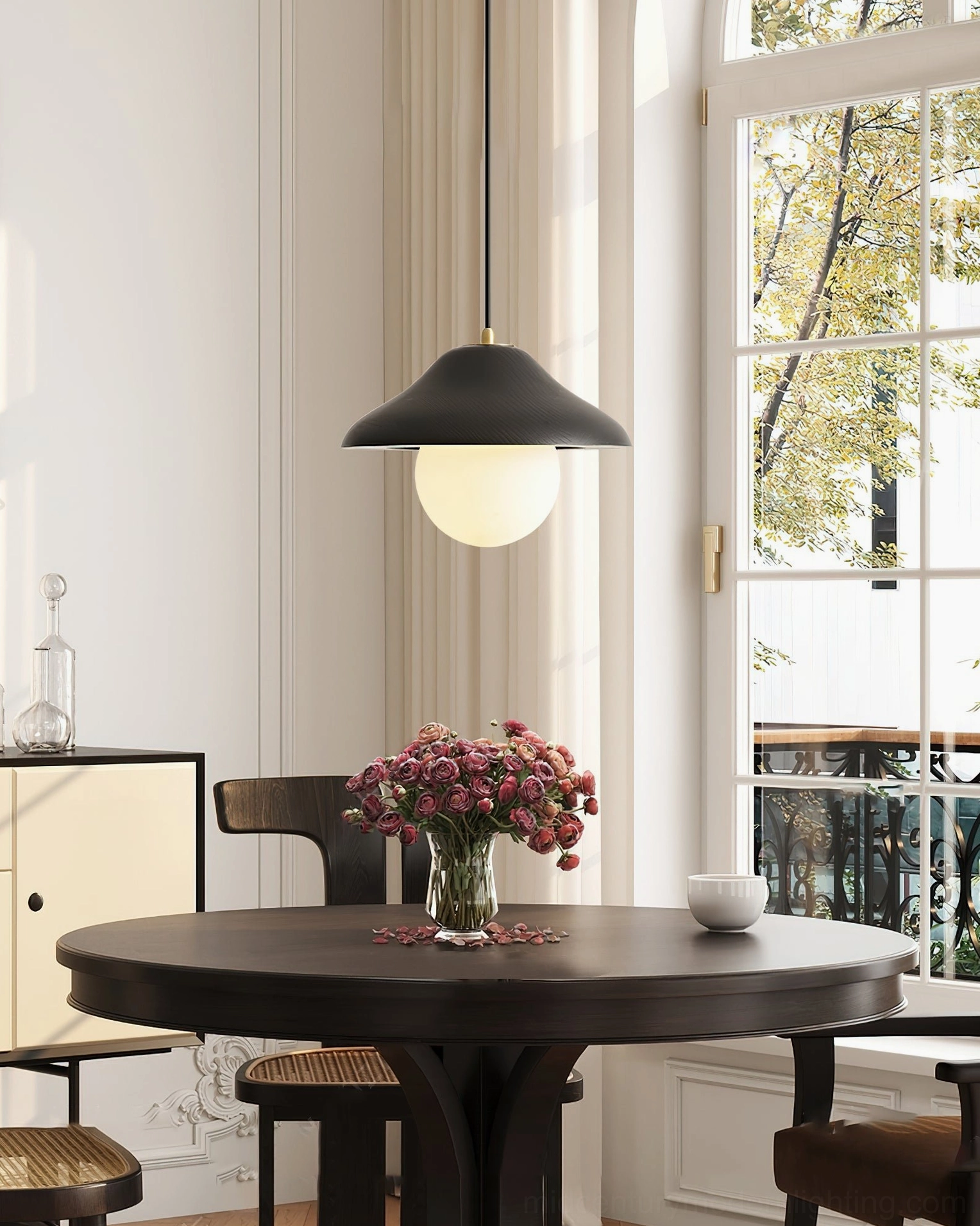 Delano pendant light above window-side dining nook with minimalist vintage Scandinavian aesthetic and soft illumination