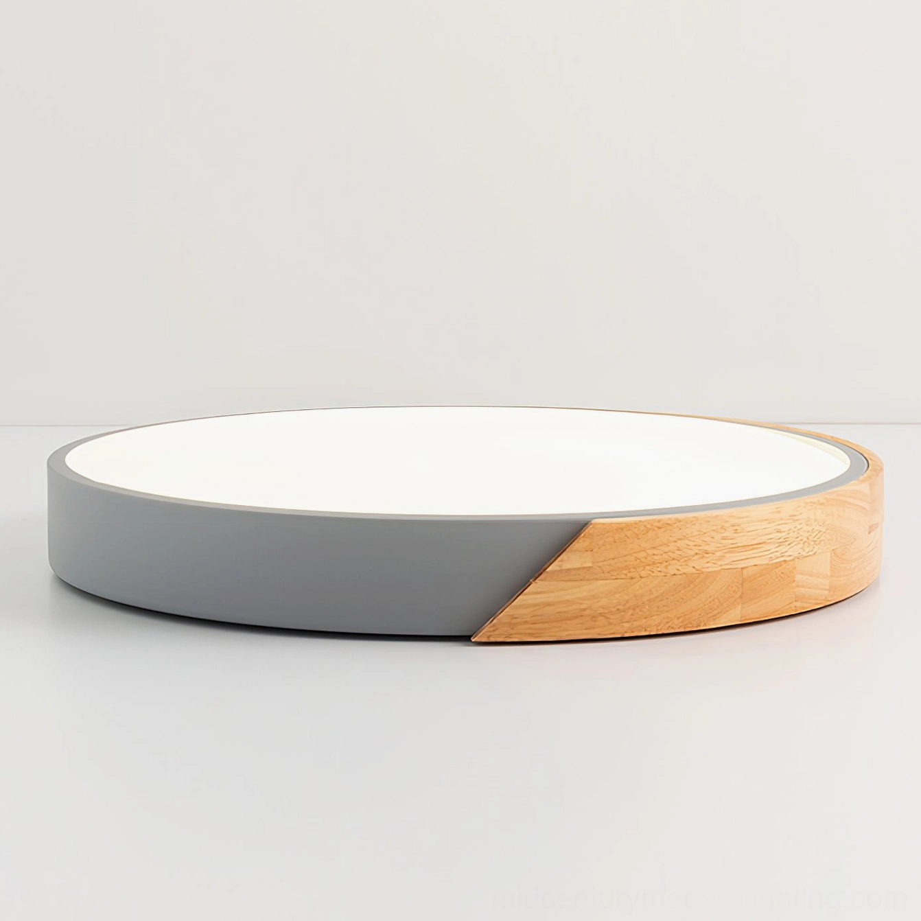 Side profile of Delphi round flush mount ceiling light displaying flat circular form and slim 5cm height