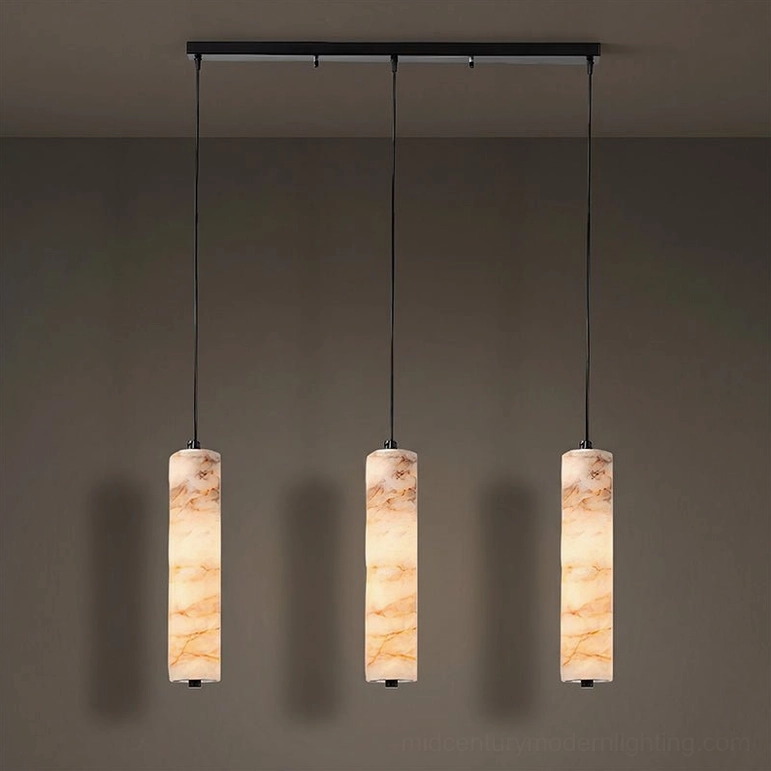 Devane alabaster three-light pendant cluster Model A showing linear arrangement with three cylindrical stone shades and coordinated matte black hardware