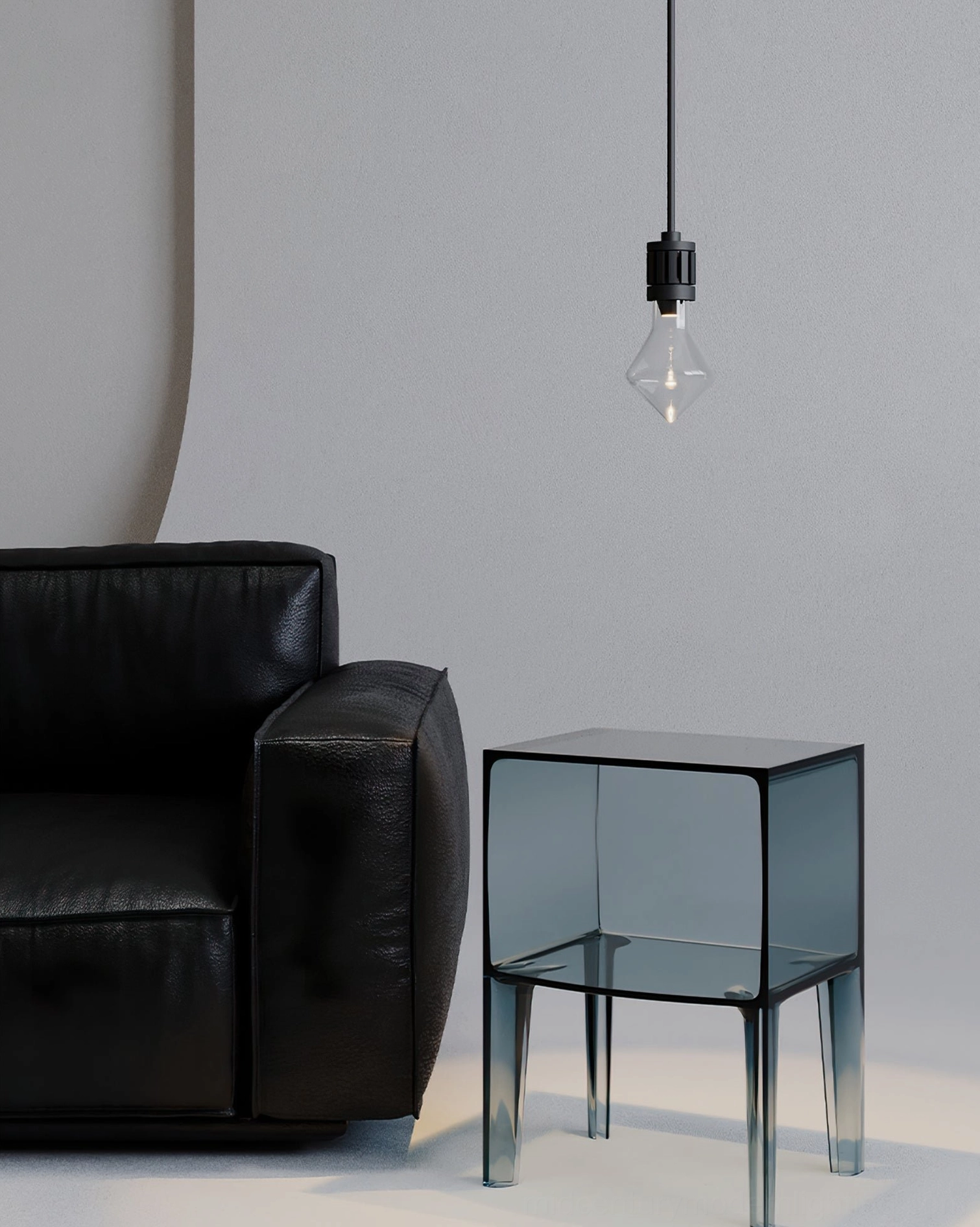 Side view of modern diamond pendant lamp suspended in contemporary living room with leather sofa and glass side table
