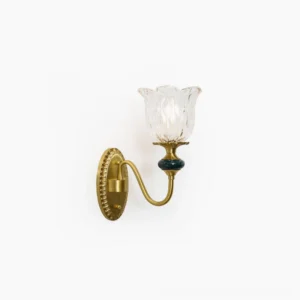 Dieppe brass wall sconce with blue ceramic accent and textured clear glass shade studio front view