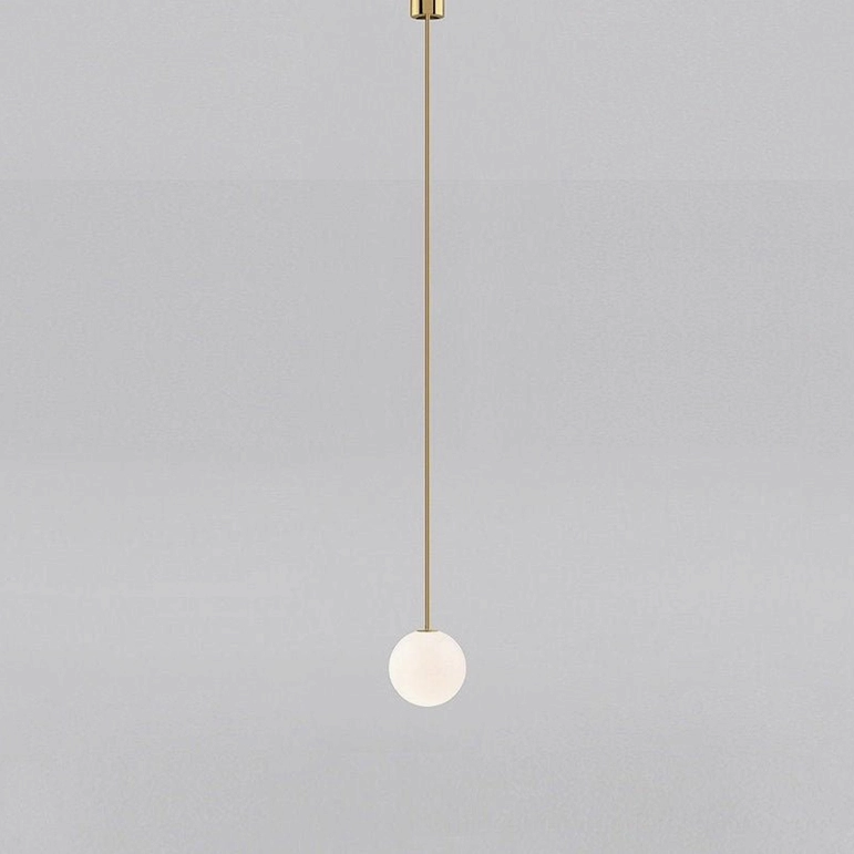 Dimmable brass globe pendant light with soft warm white illumination in ambient setting