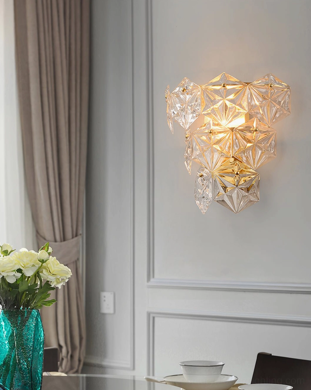 Geometric crystal wall lamp mounted in dining room accent wall with polished gold finish