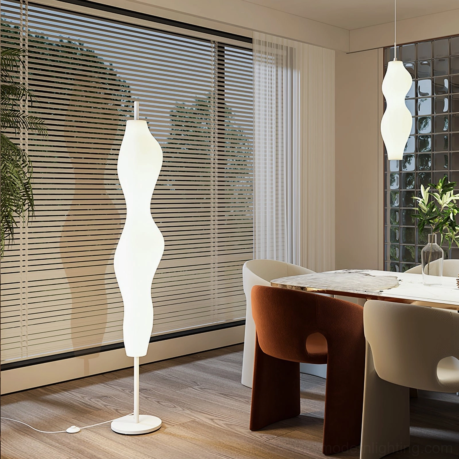 Sculptural biomorphic lamp illuminating modern dining room with large windows
