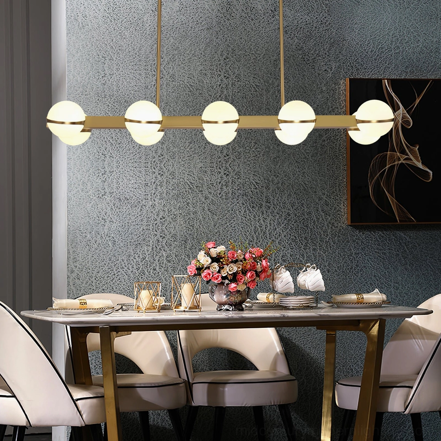Modern linear pendant light above dining table, Grand Lustre brass frame with frosted glass shades, semi-enclosed design