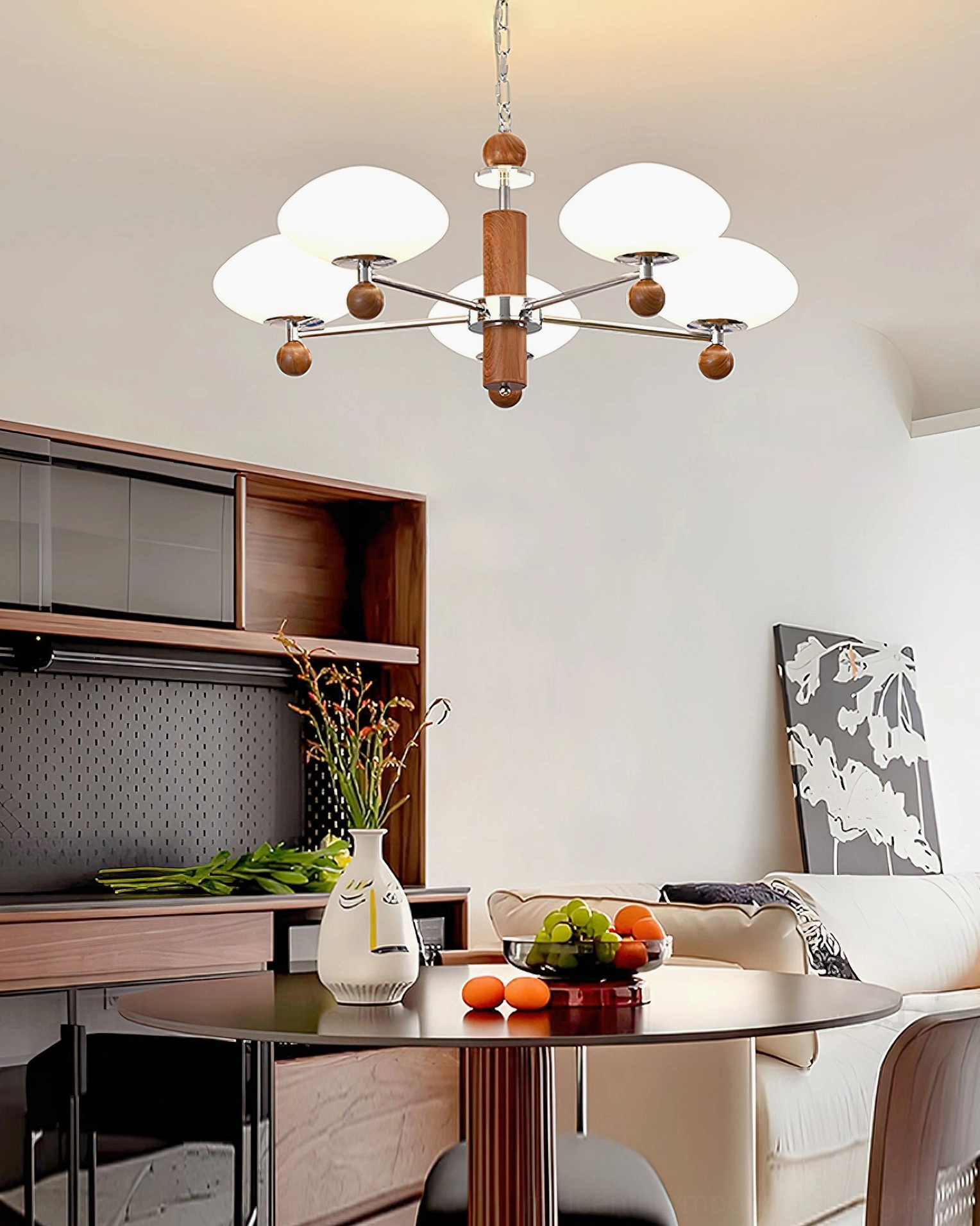 Dining room pendant chandelier installation - warm retro modern light fixture above dining table with side cabinet and warm tones
