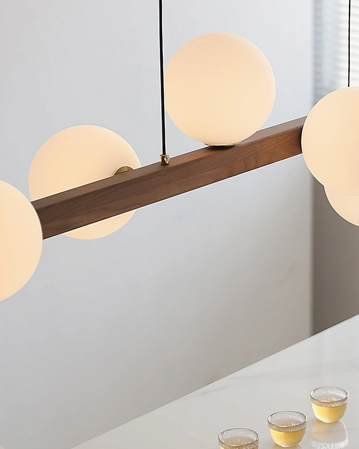 Dioniso chandelier close-up detail view of walnut wood and frosted glass components