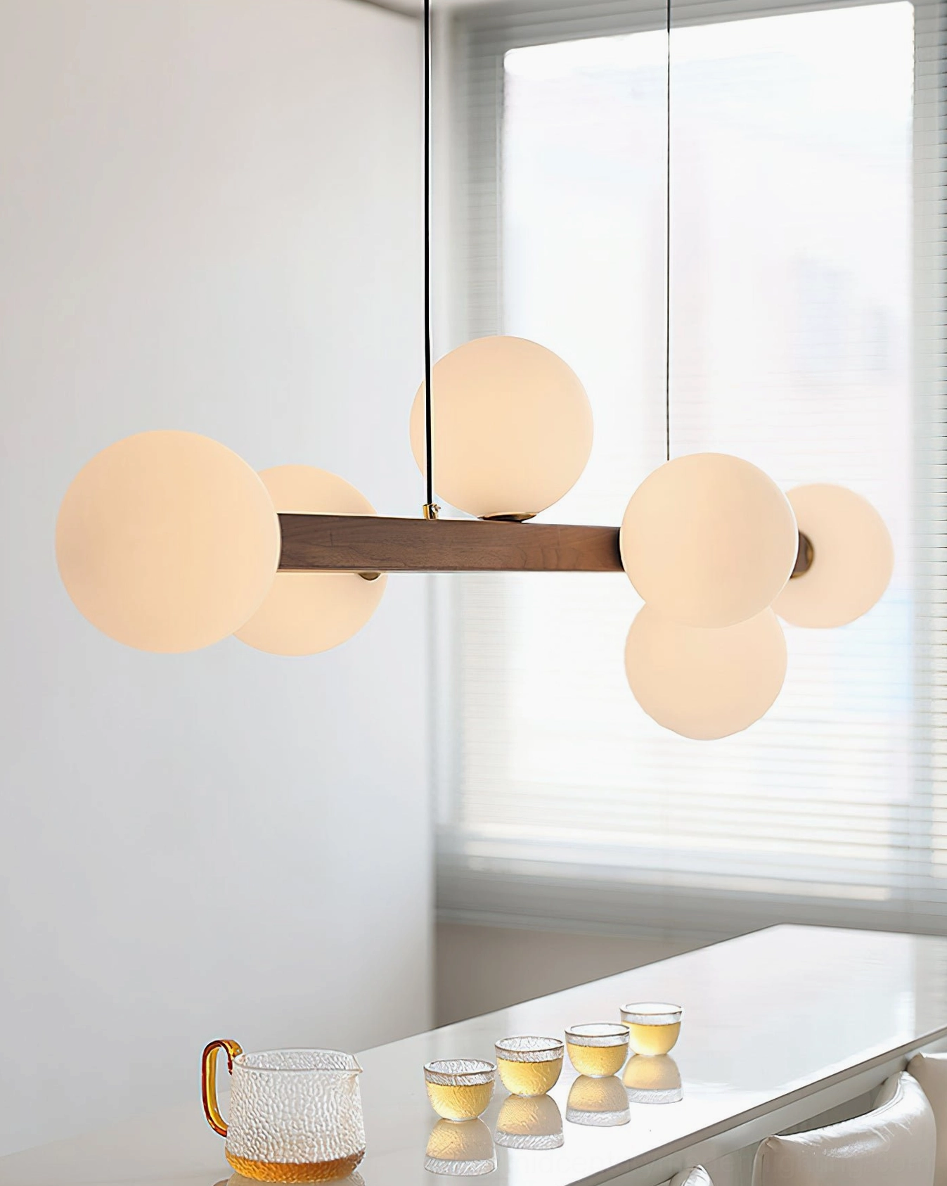 Dioniso wood glass chandelier side interior view bright dining room natural light