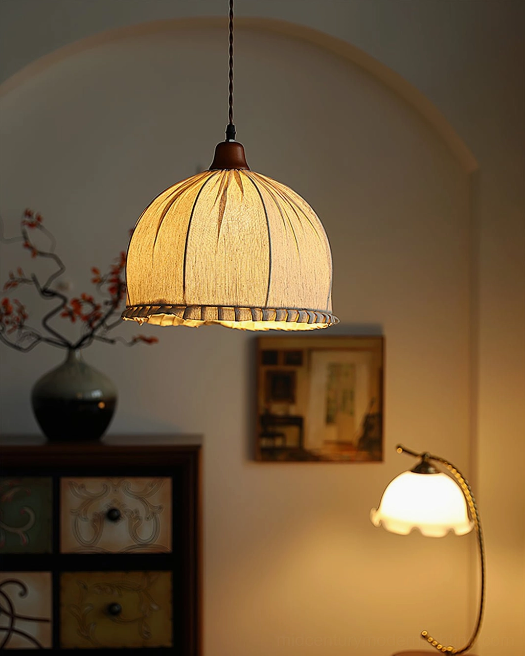 Dippa pendant light low-angle view in bedroom alcove casting warm diffused glow