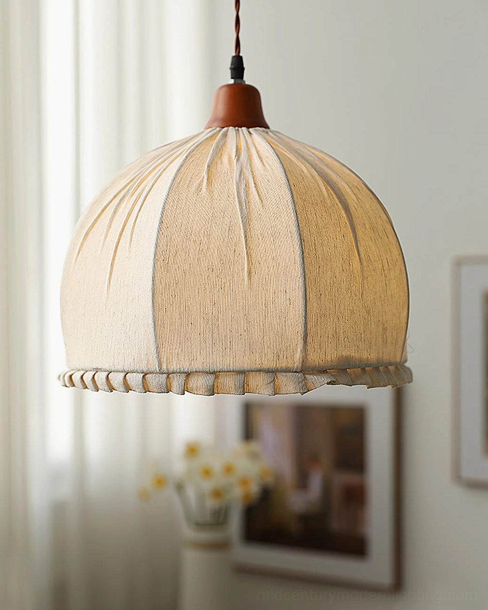 Dippa pendant light mounted in modern dining space creating warm ambient illumination