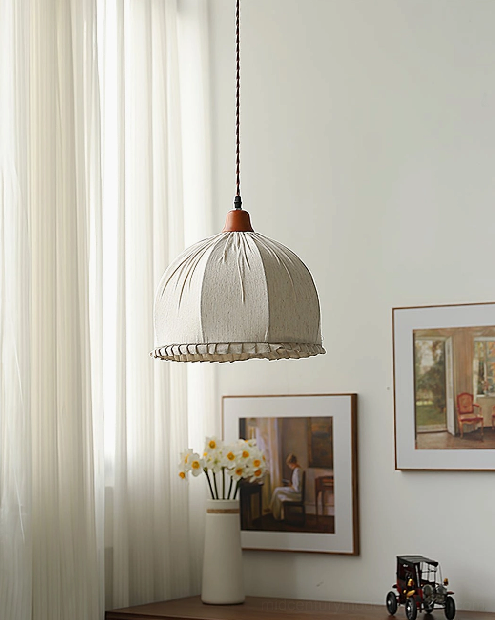 Dippa fabric pendant showing overall silhouette with ruffled base hem in warm interior lighting