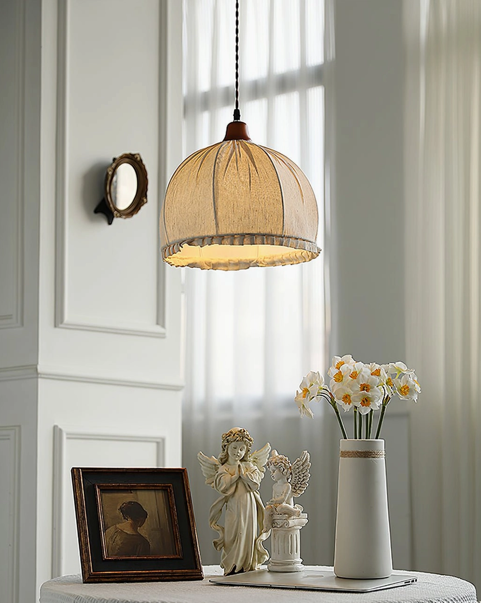 Dippa handcrafted pendant side view in minimalist white interior with sheer curtains