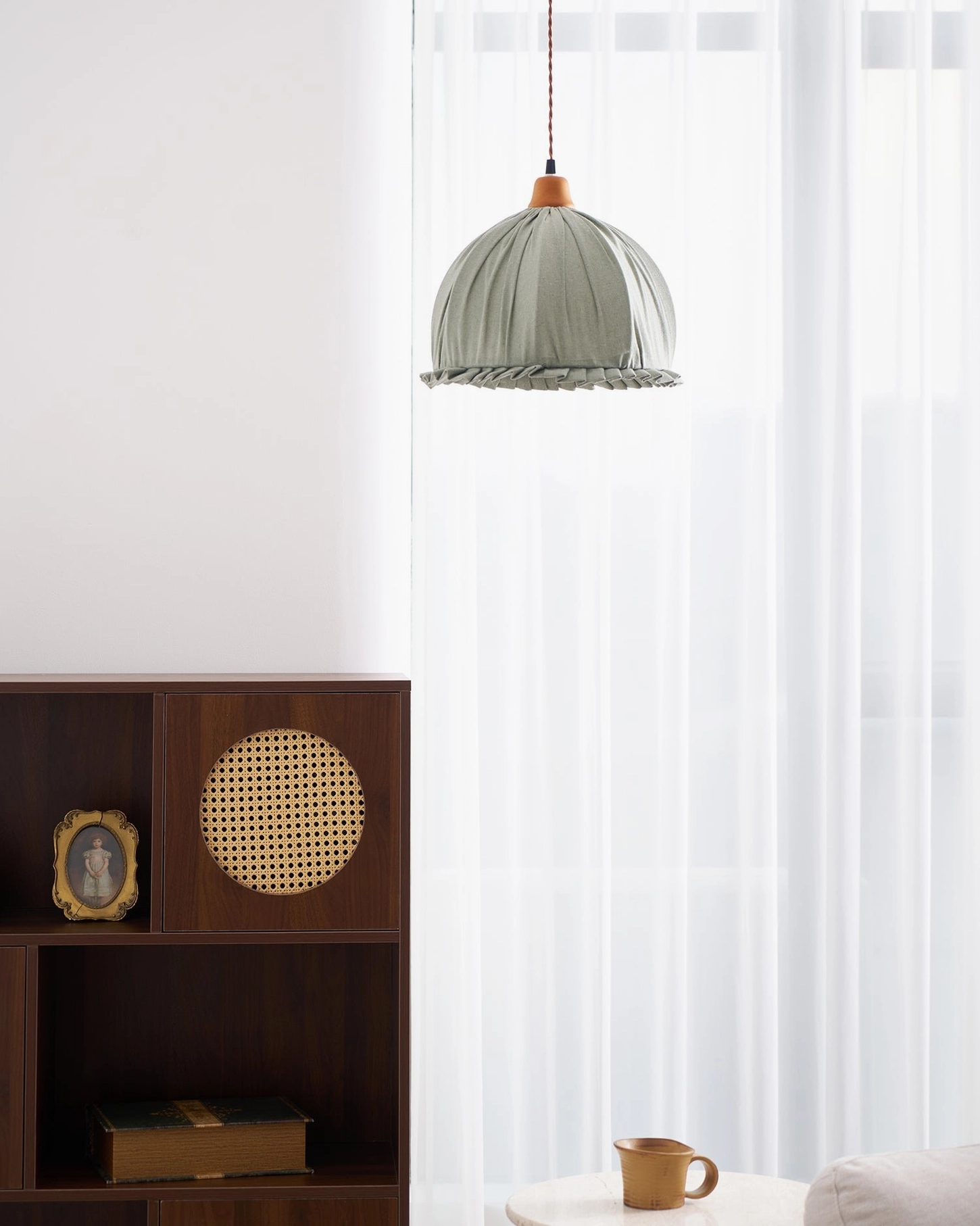 Dippa pendant with sage green fabric shade and natural wood cap detail photography