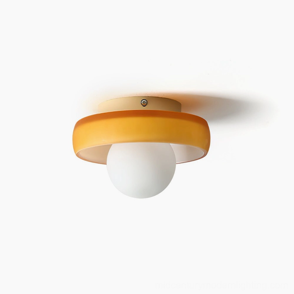 Disc Orb Ceiling Light with white frosted globe and orange metal frame, overhead close-up view on white background