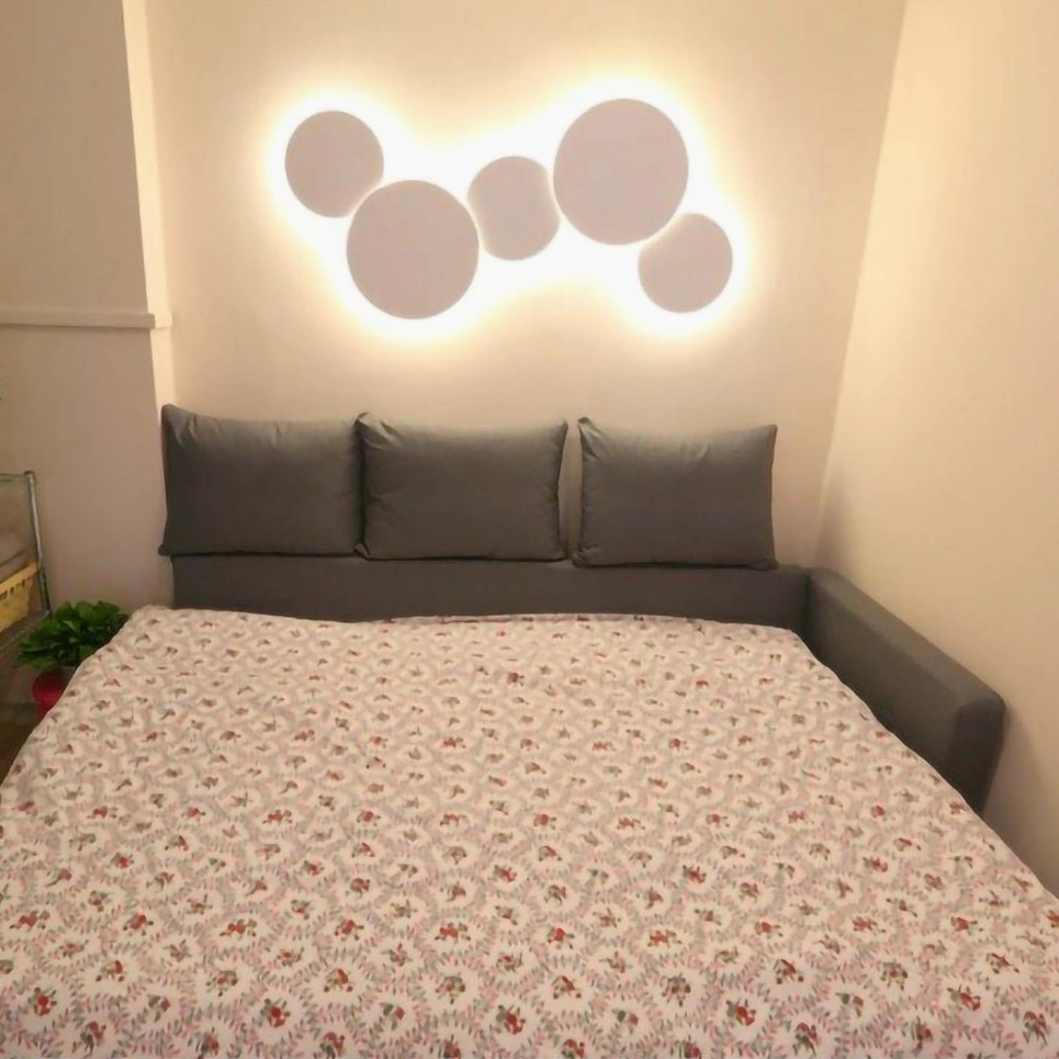 Modern disc wall lamp showing elegant negative space design and mathematical geometric composition for art installations