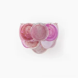 Handcrafted disc wall lamp with pink gradient glass discs, front studio view showing artisanal swirled translucent pattern