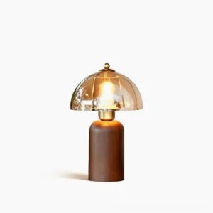Disko mid-century modern table lamp with walnut base and amber glass dome, front studio view