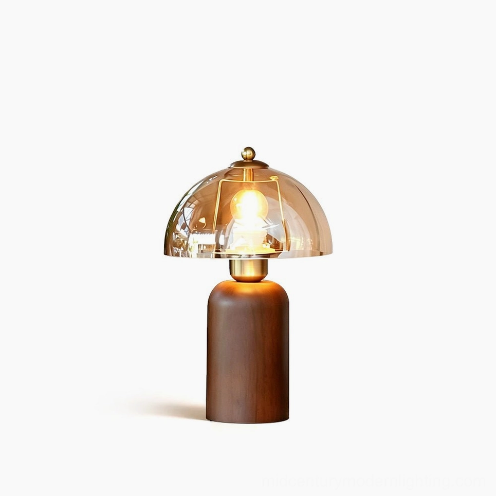 Disko mid-century modern table lamp with walnut base and amber glass dome, front studio view
