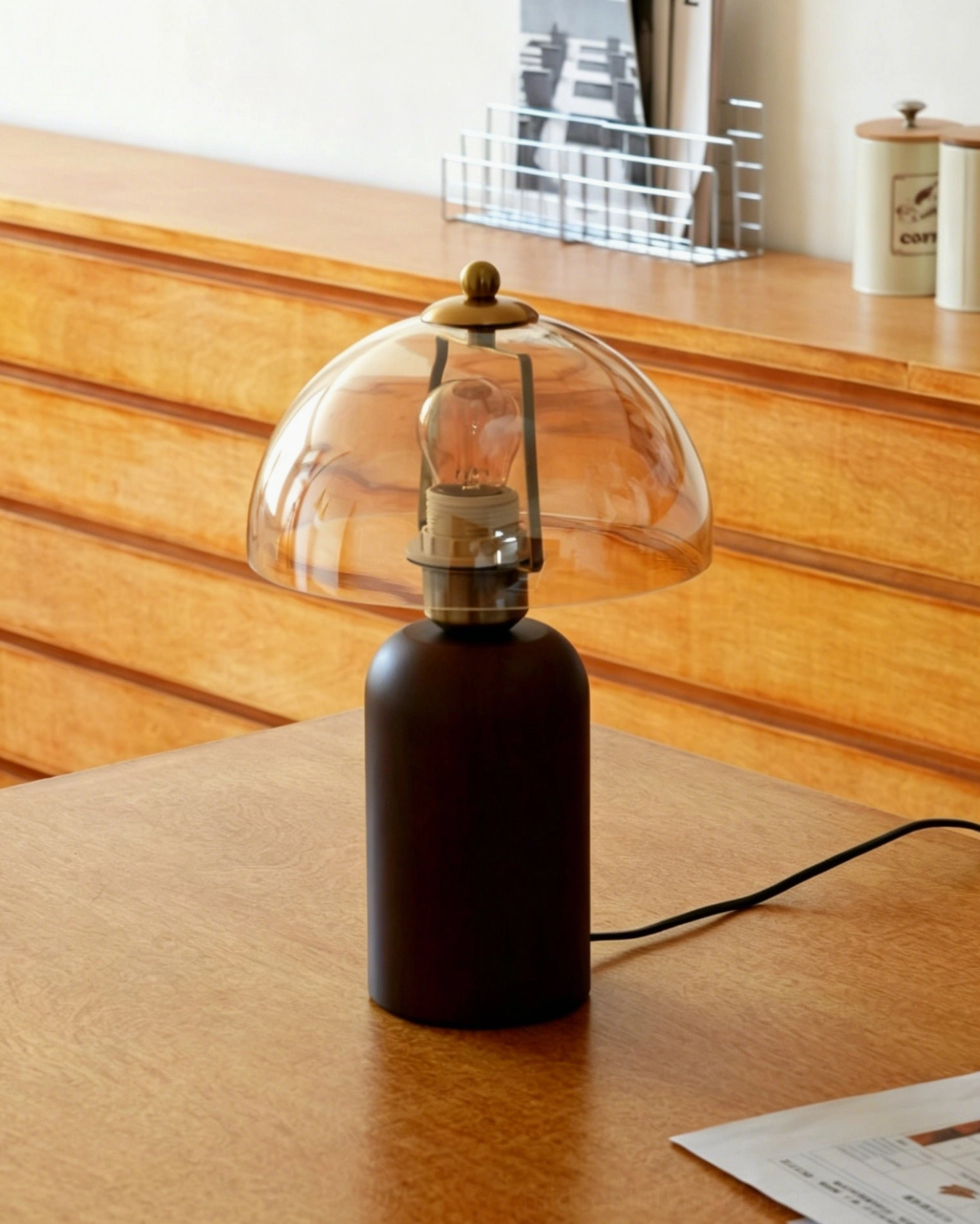 Disko table lamp on wooden desk with modern interior background, mid-century modern desk lighting