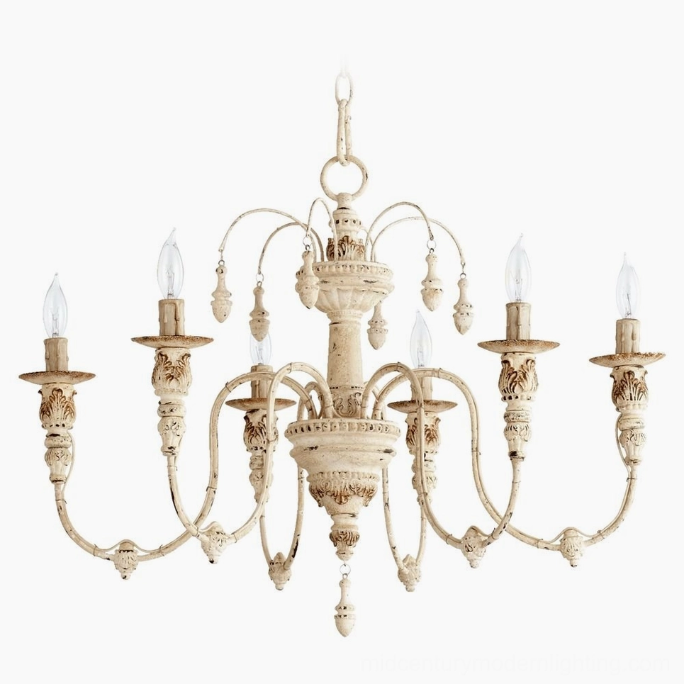 Eight-arm distressed white candelabra chandelier with cream finish, detailed carved center and drop ornaments