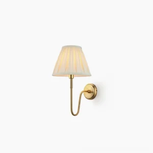 Dixon brass wall sconce with pleated fabric shade front view studio shot