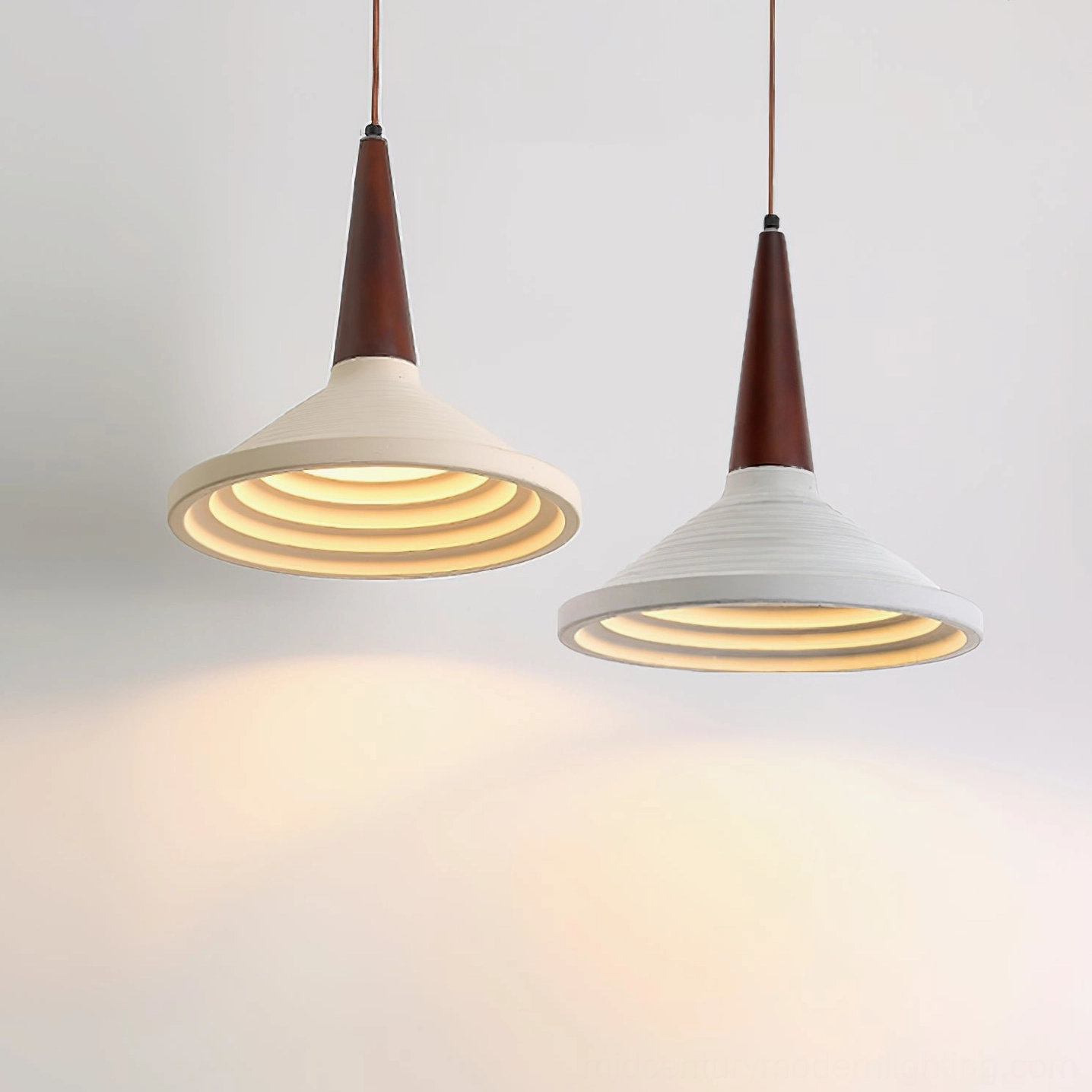 Pair of matching Doherty pendant lamps close-up, ribbed travertine shade and two-tone color scheme