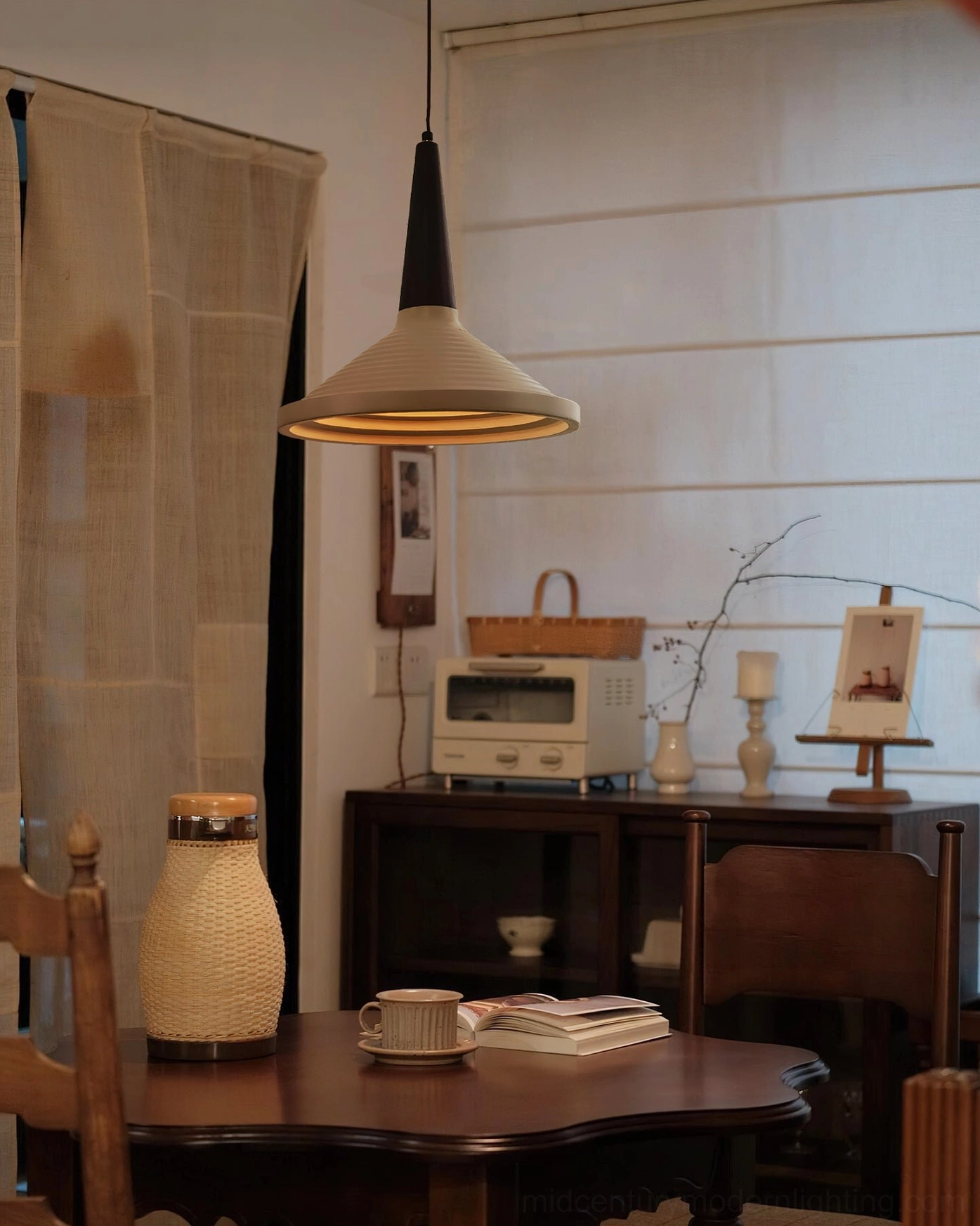 Doherty pendant lamp in vintage dining room with dark wood cabinet, farmhouse retro warmth