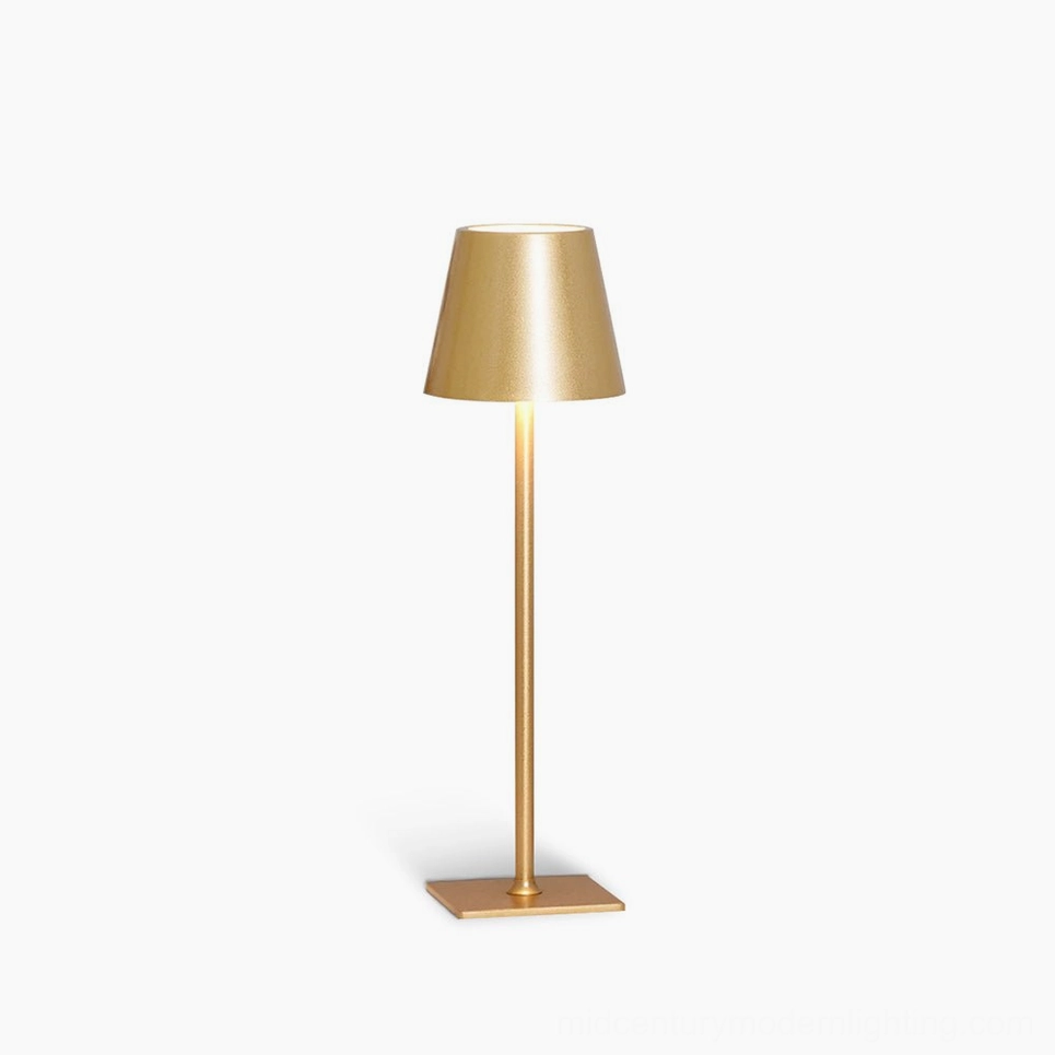 Doku cordless table lamp with gold metal finish on white background, front product view showing sleek cylindrical design