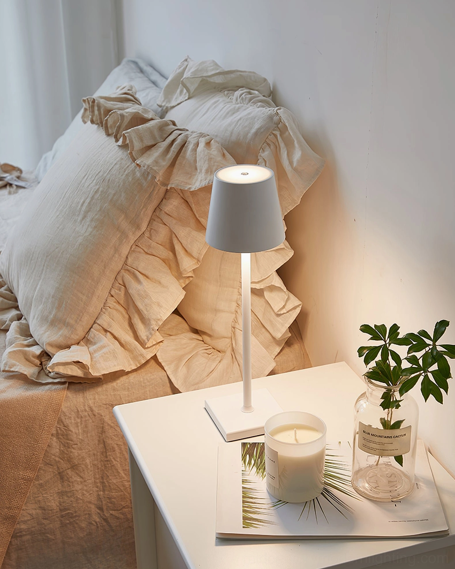 Doku cordless lamp in silver finish, sleek modern profile on tabletop surface
