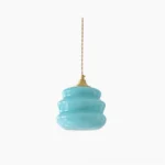 Donna aqua blue tiered pendant lamp front view with twisted fabric cord and brass fixture against white background